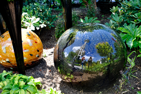 big black ball that shows the reflections of photographers